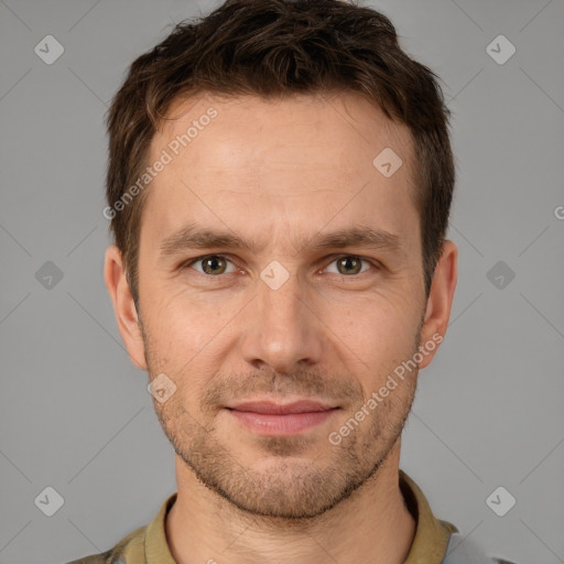 Joyful white adult male with short  brown hair and brown eyes