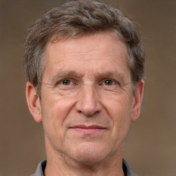 Joyful white middle-aged male with short  brown hair and brown eyes