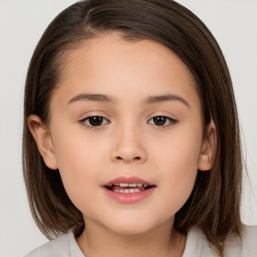 Joyful white child female with medium  brown hair and brown eyes