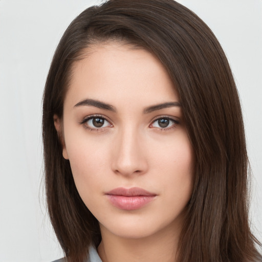 Neutral white young-adult female with long  brown hair and brown eyes