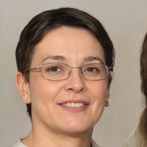 Joyful white adult female with short  brown hair and brown eyes