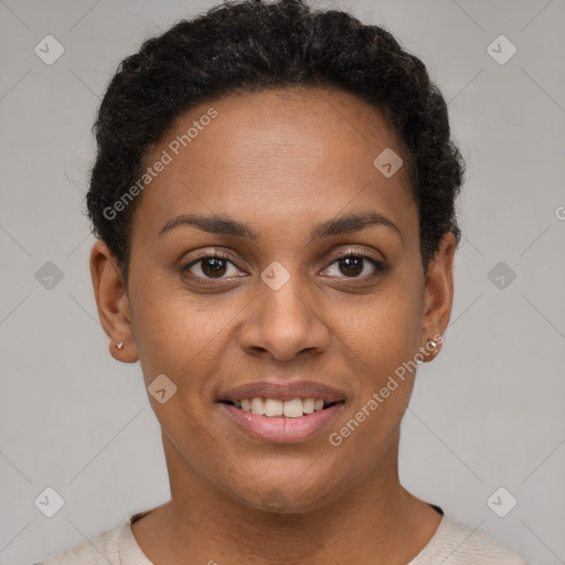 Joyful black young-adult female with short  brown hair and brown eyes