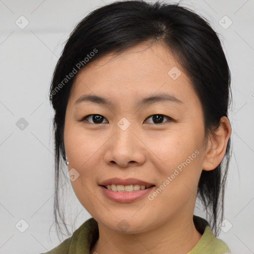 Joyful asian young-adult female with medium  brown hair and brown eyes