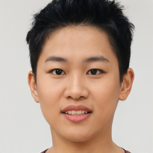 Joyful asian young-adult female with short  brown hair and brown eyes