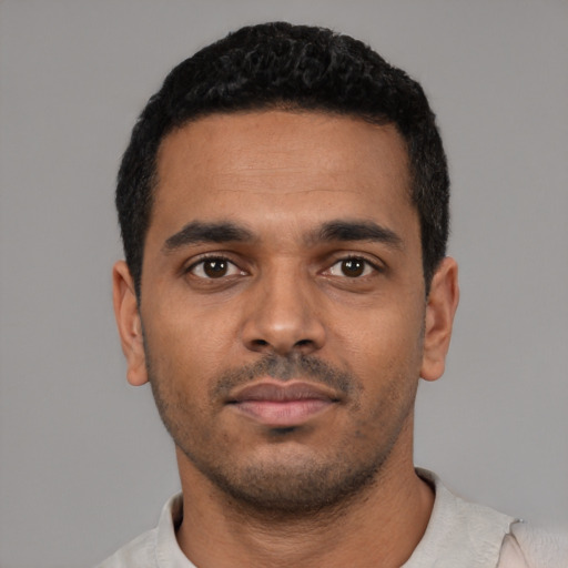 Neutral latino young-adult male with short  black hair and brown eyes