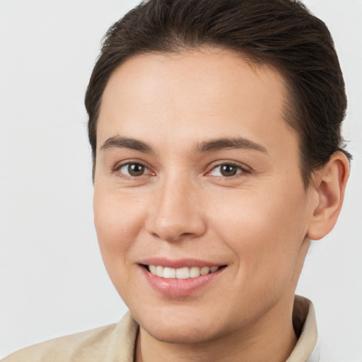 Joyful white young-adult female with short  brown hair and brown eyes