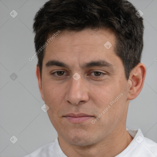 Joyful white adult male with short  brown hair and brown eyes