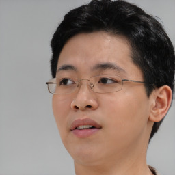 Neutral asian young-adult male with short  brown hair and brown eyes