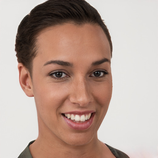 Joyful white young-adult female with short  brown hair and brown eyes