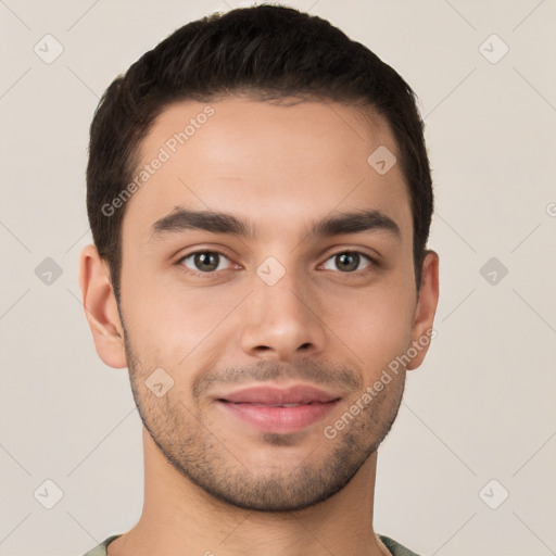 Joyful white young-adult male with short  brown hair and brown eyes