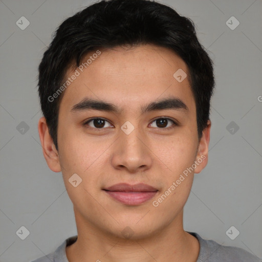 Joyful latino young-adult male with short  brown hair and brown eyes