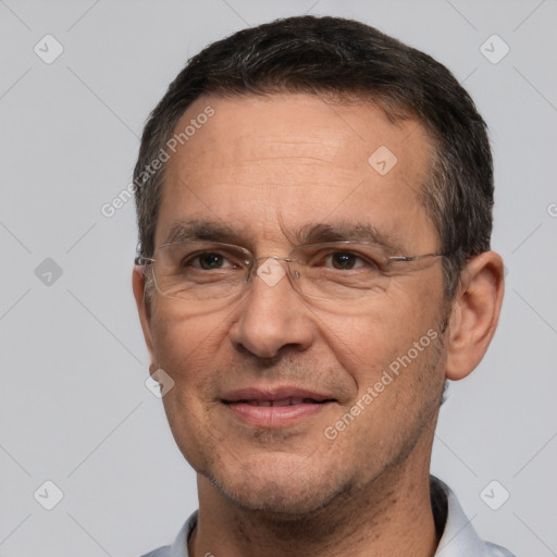 Joyful white adult male with short  brown hair and brown eyes