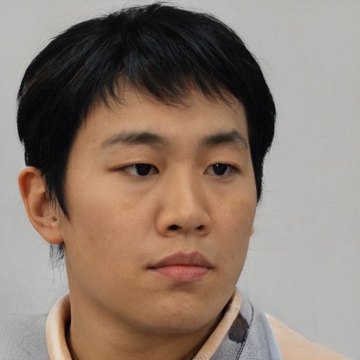 Neutral asian young-adult male with short  brown hair and brown eyes