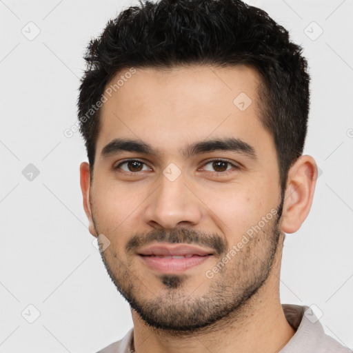 Joyful latino young-adult male with short  black hair and brown eyes