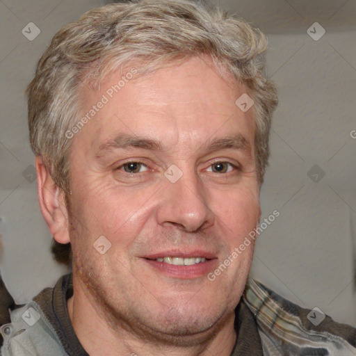 Joyful white adult male with short  brown hair and grey eyes