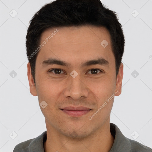 Joyful white young-adult male with short  black hair and brown eyes