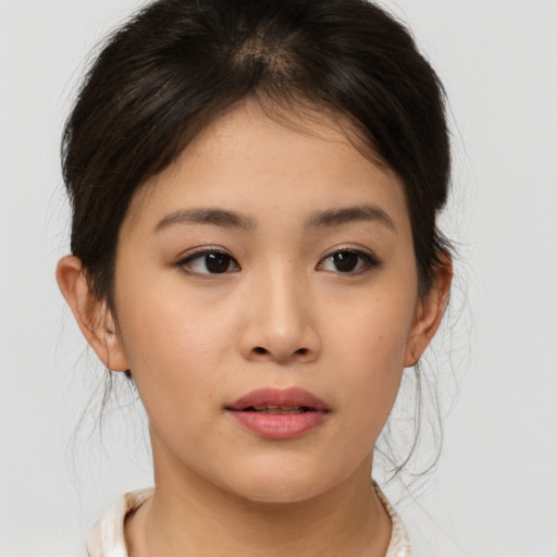 Neutral asian young-adult female with medium  brown hair and brown eyes