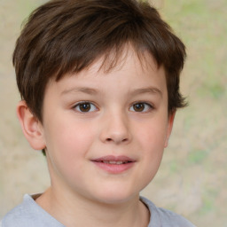 Joyful white child male with short  brown hair and brown eyes