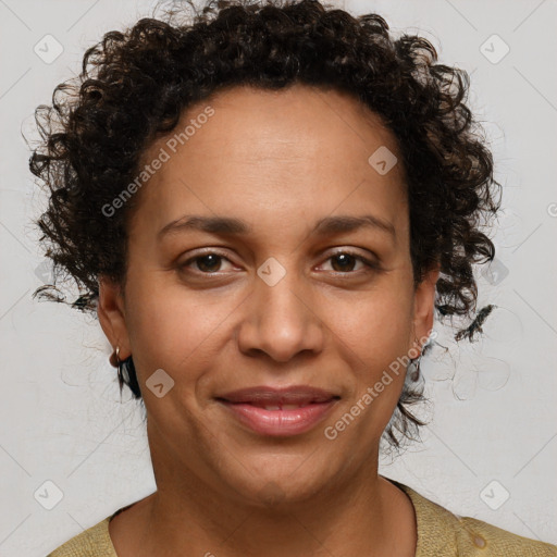 Joyful black adult female with short  brown hair and brown eyes