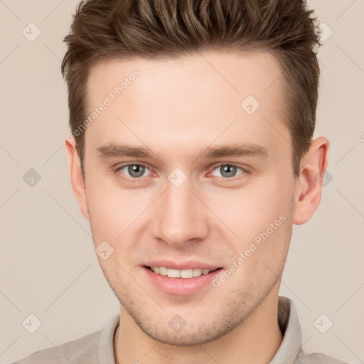 Joyful white young-adult male with short  brown hair and brown eyes