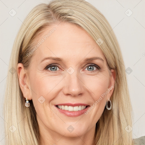 Joyful white adult female with long  brown hair and grey eyes