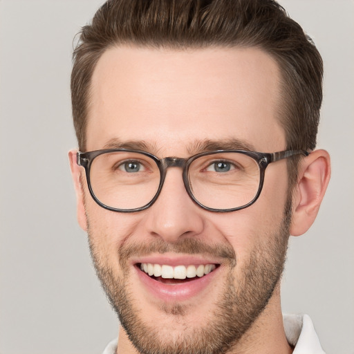 Joyful white young-adult male with short  brown hair and brown eyes