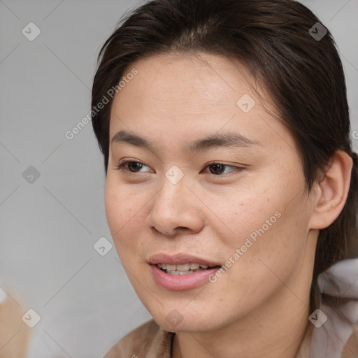 Joyful asian young-adult female with medium  brown hair and brown eyes