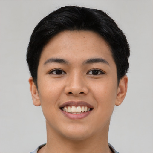 Joyful asian young-adult female with short  black hair and brown eyes