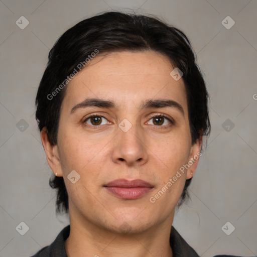 Joyful white adult female with short  brown hair and brown eyes