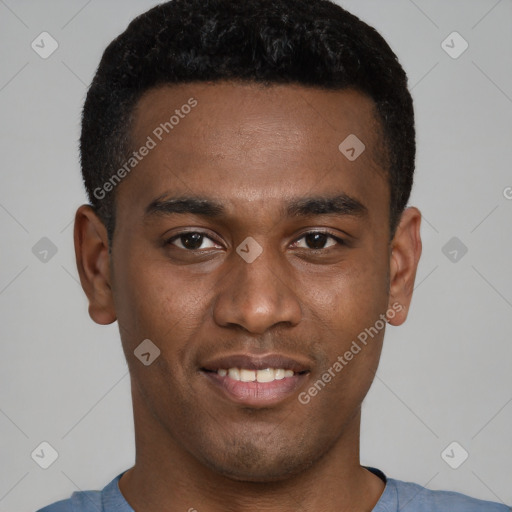 Joyful black young-adult male with short  brown hair and brown eyes