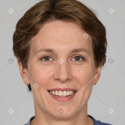 Joyful white adult female with short  brown hair and grey eyes