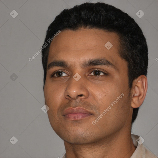 Neutral black young-adult male with short  black hair and brown eyes