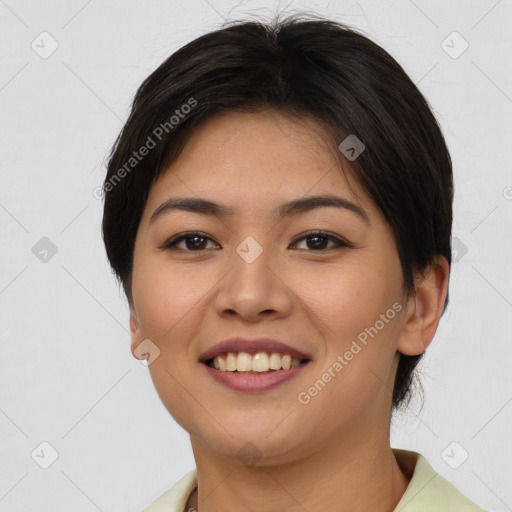 Joyful asian young-adult female with short  brown hair and brown eyes