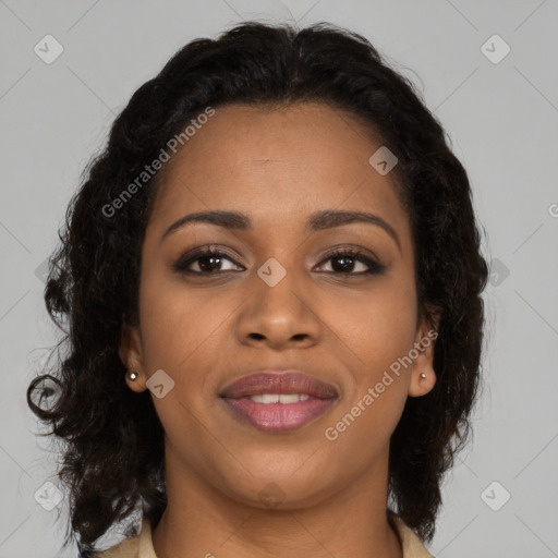 Joyful black young-adult female with long  brown hair and brown eyes