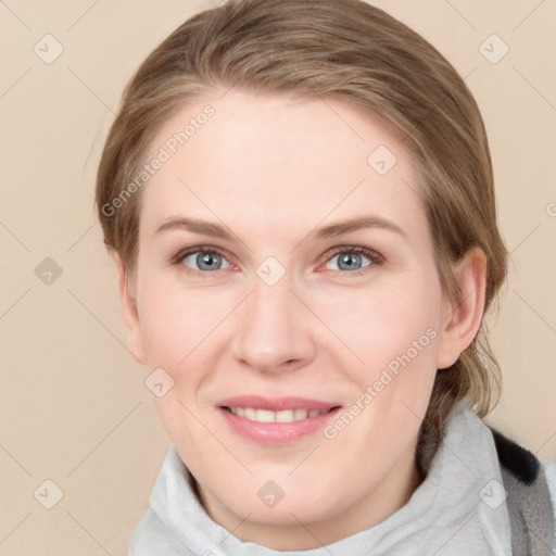 Joyful white young-adult female with medium  brown hair and blue eyes