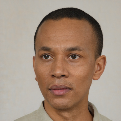 Neutral black adult male with short  black hair and brown eyes