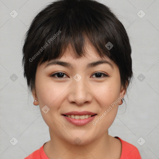 Joyful asian young-adult female with short  brown hair and brown eyes