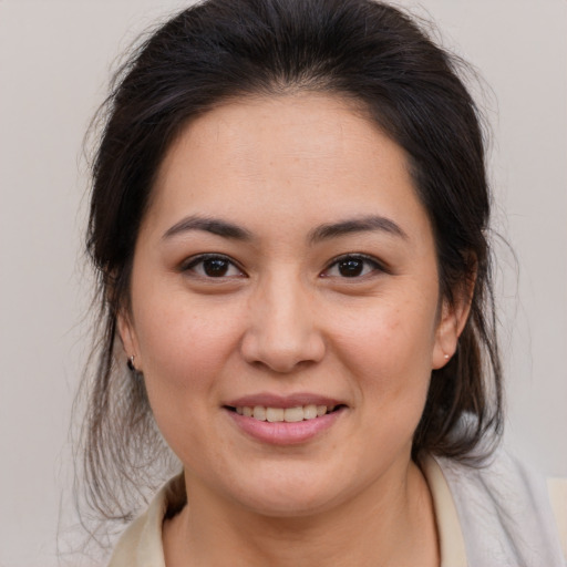 Joyful white young-adult female with medium  brown hair and brown eyes