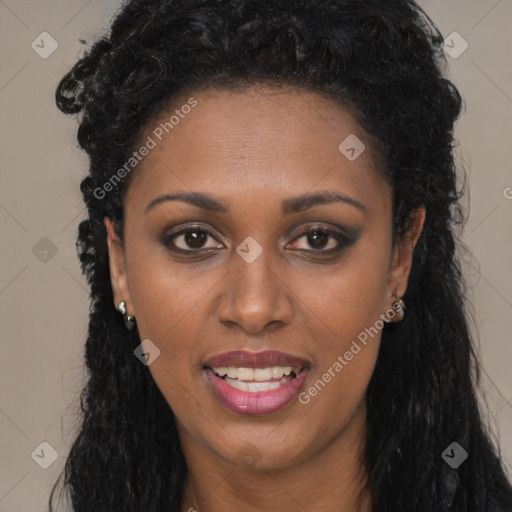 Joyful black young-adult female with long  black hair and brown eyes
