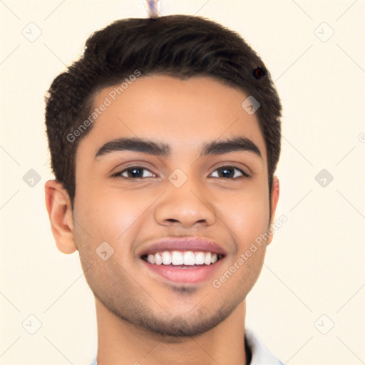 Joyful white young-adult male with short  black hair and brown eyes