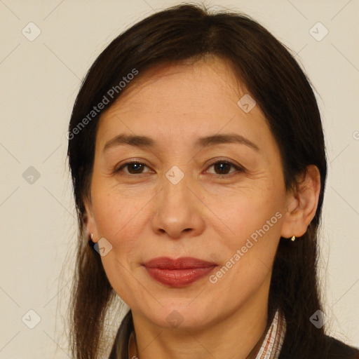 Joyful white adult female with long  brown hair and brown eyes