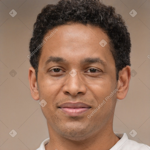 Joyful latino adult male with short  brown hair and brown eyes