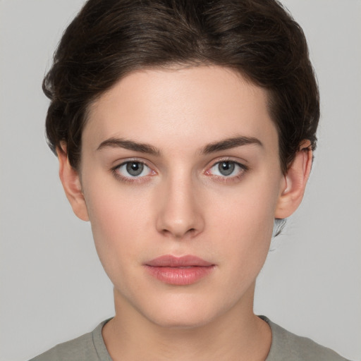 Neutral white young-adult female with short  brown hair and brown eyes