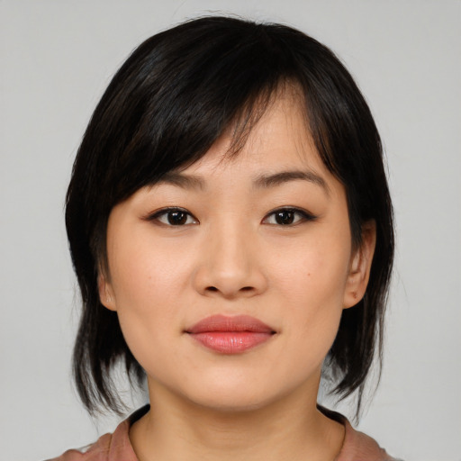 Joyful white young-adult female with medium  black hair and brown eyes