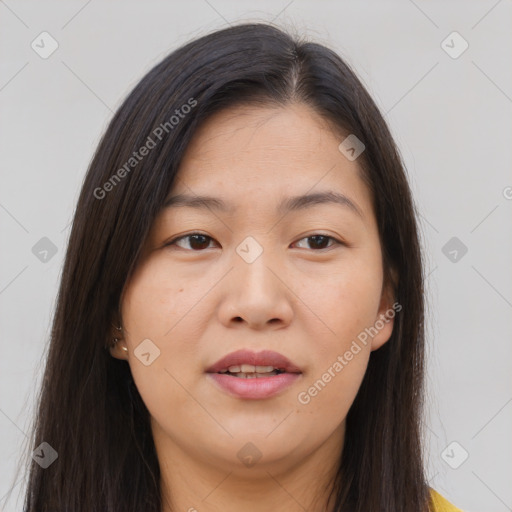 Joyful asian young-adult female with long  brown hair and brown eyes