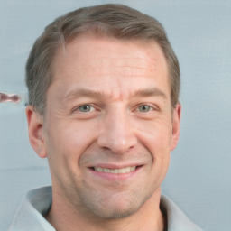 Joyful white adult male with short  brown hair and grey eyes