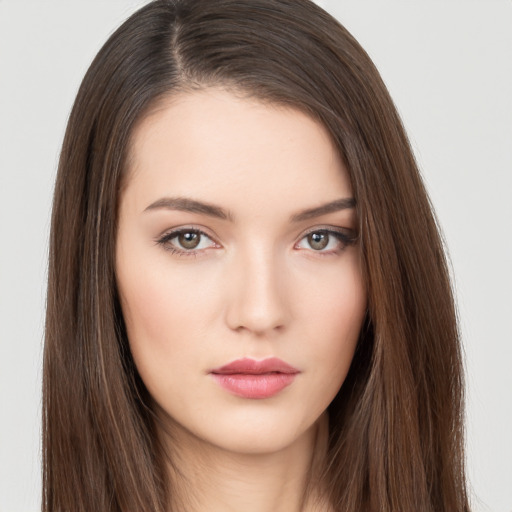 Neutral white young-adult female with long  brown hair and brown eyes