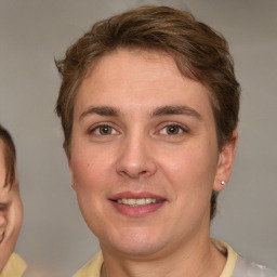 Joyful white young-adult female with short  brown hair and grey eyes