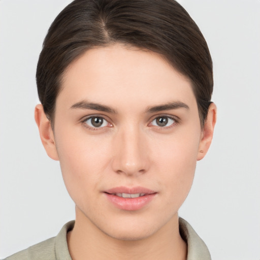 Neutral white young-adult female with short  brown hair and brown eyes