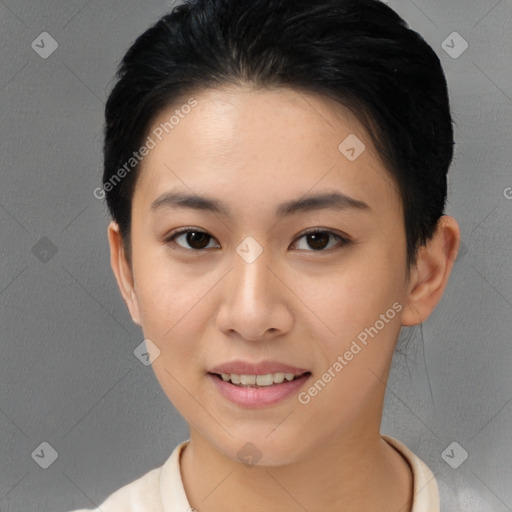 Joyful asian young-adult female with short  brown hair and brown eyes